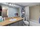 This bathroom features a vanity with a sink, a mirror, and a shower with a curtain at 1489 Magellan Cir # 603, Orlando, FL 32818