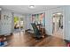 Bonus room features hardwood floors, a treadmill, and sliding glass doors to the outside at 1489 Magellan Cir # 603, Orlando, FL 32818