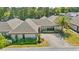 Aerial view of a well-maintained home with a lush green lawn and a well-manicured front yard at 1489 Magellan Cir # 603, Orlando, FL 32818