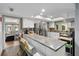 Modern kitchen with ample counter space, stainless steel appliances, and views into the living room at 1489 Magellan Cir # 603, Orlando, FL 32818