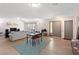 Spacious living room with light wood flooring, a large sofa, and a dining area at 1489 Magellan Cir # 603, Orlando, FL 32818
