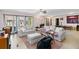 Bright living room featuring two sofas, light hardwood floors, and ample natural light at 1489 Magellan Cir # 603, Orlando, FL 32818