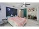 Main bedroom features gray carpet, neutral paint, ceiling fan, and closet space at 1489 Magellan Cir # 603, Orlando, FL 32818