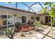 This covered patio features a variety of plants, and access to the home's various rooms at 1489 Magellan Cir # 603, Orlando, FL 32818