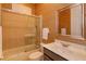 Bathroom with a shower-tub combination, framed mirror and a sink at 1704 Kersley Cir, Lake Mary, FL 32746