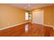 Cozy bedroom with warm hardwood floors, double closet, and natural light at 1704 Kersley Cir, Lake Mary, FL 32746