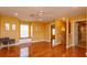 Sunlit bonus room with hardwood floors, ceiling fan, and a cozy window seat at 1704 Kersley Cir, Lake Mary, FL 32746