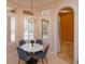 Cozy breakfast nook featuring a marble table, seating for four, and lots of natural light at 1704 Kersley Cir, Lake Mary, FL 32746