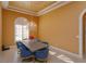 Dining room featuring a chandelier, arched windows, hardwood floors, and seating for six at 1704 Kersley Cir, Lake Mary, FL 32746