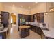 A kitchen showcases dark cabinetry, stainless steel appliances, and a butcher block island at 1704 Kersley Cir, Lake Mary, FL 32746