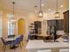 Spacious kitchen area with dark cabinets, stainless steel appliances, and a cozy breakfast nook nearby at 1704 Kersley Cir, Lake Mary, FL 32746