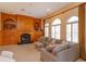 Elegant living room with built-in bookshelves, fireplace, and neutral-toned sofa at 1704 Kersley Cir, Lake Mary, FL 32746