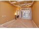 Bright living area featuring elegant tray ceilings and double doors leading to the outdoor pool at 1704 Kersley Cir, Lake Mary, FL 32746
