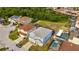 Aerial perspective highlighting a home with a pool in a Gathering-friendly neighborhood surrounded by lush greenery at 1735 Pine Ridge Dr, Davenport, FL 33896