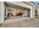 Spacious two-car garage offers ample storage and parking with potential for customization and organization at 1735 Pine Ridge Dr, Davenport, FL 33896