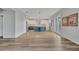 Open-concept living area connects seamlessly to a kitchen, promoting an airy and inclusive space at 1735 Pine Ridge Dr, Davenport, FL 33896