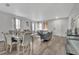 Spacious living room featuring hardwood floors, grey walls, and dining area at 1735 Pine Ridge Dr, Davenport, FL 33896