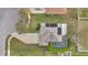 Aerial view of a home with a pool, screened lanai, solar panels, and a well-maintained lawn in a residential neighborhood at 1827 Lindzlu St, Winter Garden, FL 34787