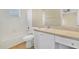 Bright bathroom featuring a tub with white tile surround and a vanity with storage at 1827 Lindzlu St, Winter Garden, FL 34787