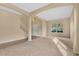 Large living room featuring neutral colors, tiled entryway, carpeted floors, and staircase to the second floor at 1827 Lindzlu St, Winter Garden, FL 34787