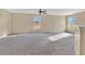 Spacious living room with neutral carpeting and multiple windows for natural light at 1827 Lindzlu St, Winter Garden, FL 34787