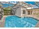 Backyard pool with a screened enclosure, concrete deck, and access to the home creates the perfect spot for relaxing and entertaining at 1827 Lindzlu St, Winter Garden, FL 34787