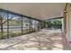 Expansive screened porch with ample space for outdoor seating and views of the lush backyard and pool at 1827 Lindzlu St, Winter Garden, FL 34787