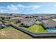 Aerial view of a neighborhood with fenced in backyards, pools, and green spaces at 1880 Bonser Rd, Minneola, FL 34715