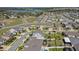Overhead shot displaying a home with a well-kept lawn, landscaping, and proximity to neighboring residences at 1880 Bonser Rd, Minneola, FL 34715