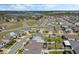 Panoramic aerial view of a residential area with lake in the background at 1880 Bonser Rd, Minneola, FL 34715