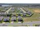 An aerial view highlights a residential property, pinpointing its location within a planned neighborhood at 1880 Bonser Rd, Minneola, FL 34715