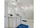 Clean bathroom featuring a walk-in shower, large mirror, and modern fixtures at 1880 Bonser Rd, Minneola, FL 34715