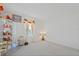 Bright bedroom featuring neutral carpet, natural light, and plenty of open space at 1880 Bonser Rd, Minneola, FL 34715