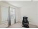 Spare bedroom featuring neutral walls and carpet, a window, and a black massage chair at 1880 Bonser Rd, Minneola, FL 34715