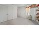 Bright bedroom with large closet, neutral carpet, and natural light at 1880 Bonser Rd, Minneola, FL 34715