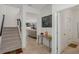 Open foyer with stairs and view of living area. Features modern decor and leads to other rooms of the home at 1880 Bonser Rd, Minneola, FL 34715