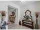 Entryway with wood-look floors, ornate console table, decorative mirror and console table decor at 1880 Bonser Rd, Minneola, FL 34715