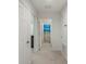 Hallway with access to bedroom and bathroom, and neutral colored carpet at 1880 Bonser Rd, Minneola, FL 34715