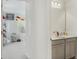 Hallway showing the view into a bedroom and bathroom at 1880 Bonser Rd, Minneola, FL 34715