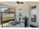 Covered lanai featuring a built-in sink and bar area with a mini refrigerator at 1880 Bonser Rd, Minneola, FL 34715