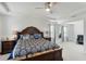 Large main bedroom featuring neutral carpet, a ceiling fan, and two windows with blinds at 1880 Bonser Rd, Minneola, FL 34715