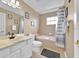 Neutral bathroom featuring a bath/shower combo and vanity at 210 Vista Loop, Davenport, FL 33897