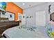 Bright bedroom boasts colorful accents, television, and playful decor at 210 Vista Loop, Davenport, FL 33897