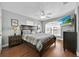 Spacious bedroom features a ceiling fan and large window for natural light at 210 Vista Loop, Davenport, FL 33897