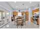 Eat-in kitchen featuring stainless steel appliances and sliding doors to the outside patio at 210 Vista Loop, Davenport, FL 33897