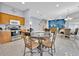Eat-in kitchen offering views of the open floor plan and adjoining dining and living spaces at 210 Vista Loop, Davenport, FL 33897