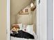 Cozy Harry Potter-themed reading nook featuring decorative pillows, a small shelf, and a furry rug at 210 Vista Loop, Davenport, FL 33897