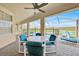 Covered patio with furniture overlooking the backyard swimming pool at 210 Vista Loop, Davenport, FL 33897