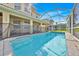 Inviting screened-in pool with clear blue water and surrounding patio, perfect for relaxation and outdoor enjoyment at 210 Vista Loop, Davenport, FL 33897