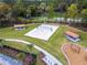 Aerial view of the community volleyball court, playground and picnic pavilions at 219 Meghan Cir, Deland, FL 32724